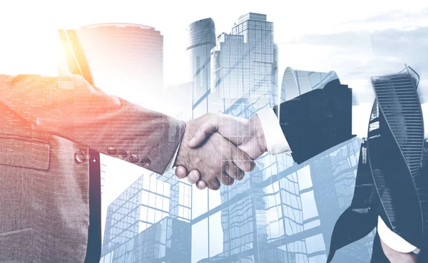 Handshake in city, business partnership — Stock Photo, Image