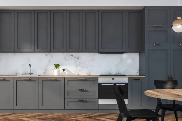 Gray and marble kitchen with table