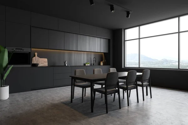 Canto da cozinha loft cinza escuro com mesa — Fotografia de Stock