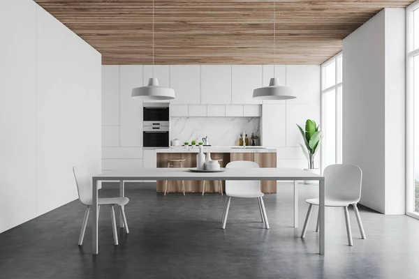 Weiße Kücheneinrichtung mit Theke und Tisch — Stockfoto