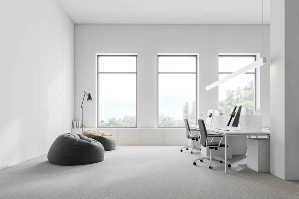 White open space office with lounge