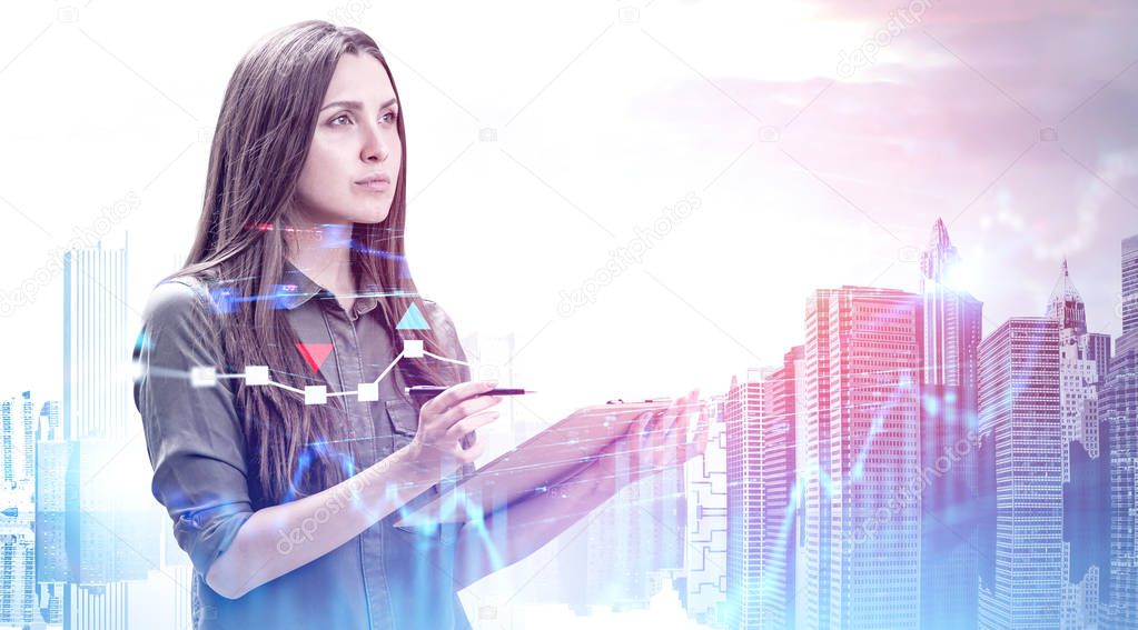 Businesswoman with clipboard in city, graphs