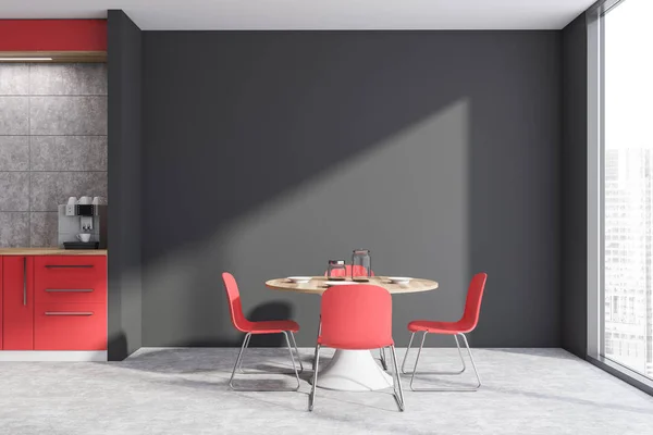 Red and gray kitchen interior with table