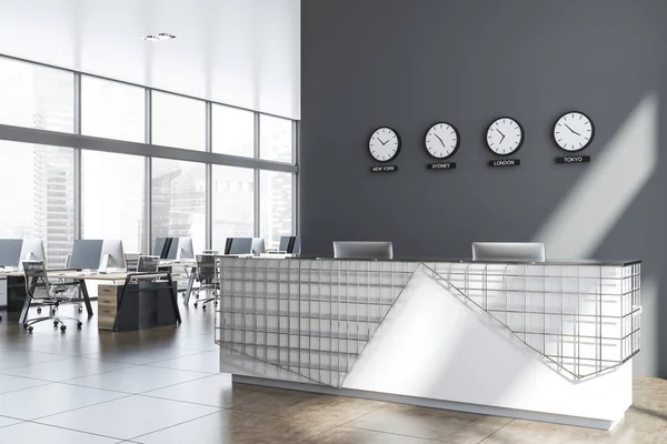 Gray and metal office reception table with clocks