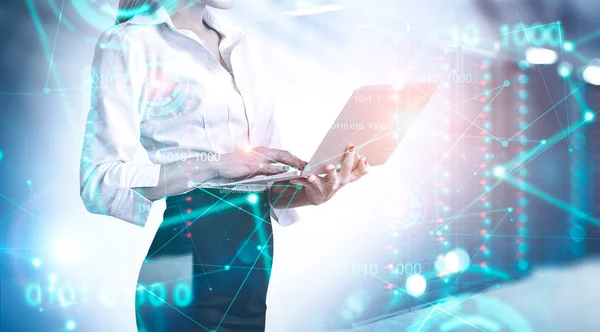 Woman with laptop in server room — Stock Photo, Image