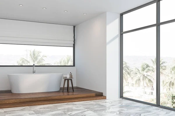 Белый уголок ванной комнаты мансарды с тюбиком — стоковое фото