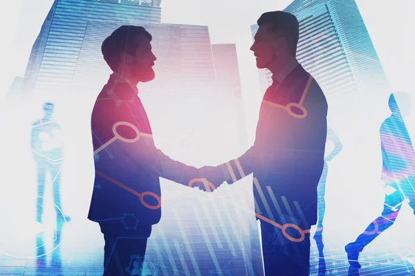 Businessmen shaking hands in city, graphs — Stock Photo, Image