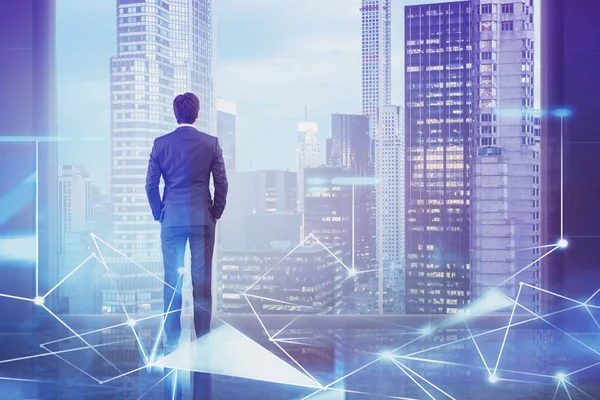 Businessman looking at city, network interface