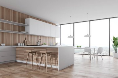 Bar ve masa ile beyaz ve ahşap mutfak köşesi