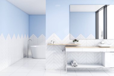 Lavabo ve küvetile beyaz ve mavi banyo
