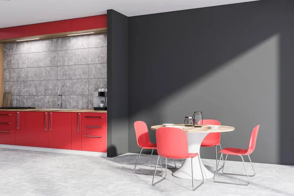 Coin cuisine rouge et gris avec table — Photo