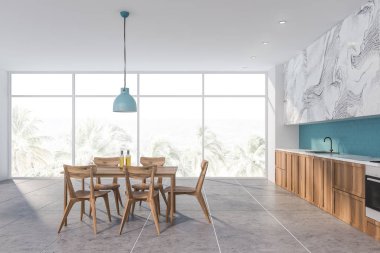 Masa ile mavi ve beyaz mermer mutfak