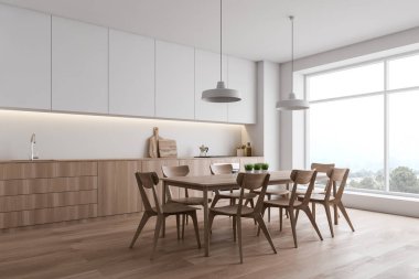 Masa ile panoramik beyaz mutfak köşesi