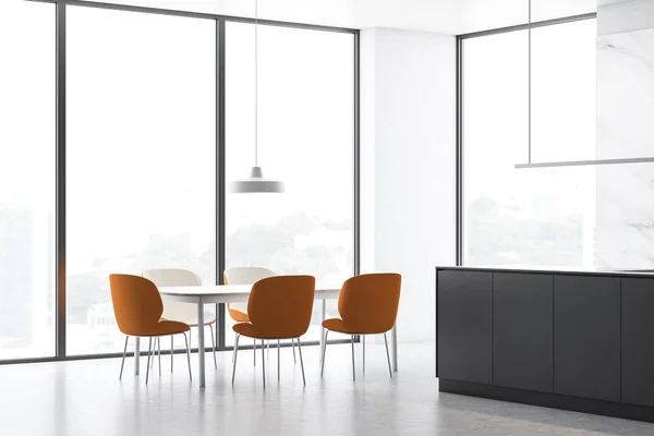 White loft kitchen corner with dining table