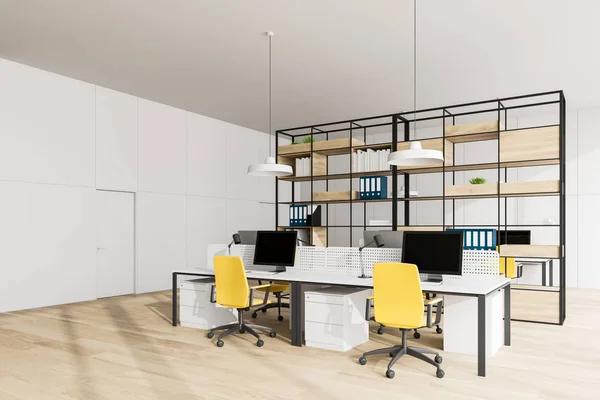 White open space office corner with bookcase