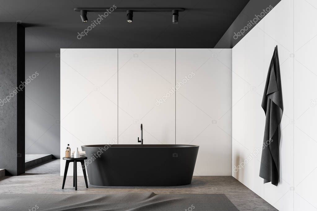 White and gray bathroom interior with tub