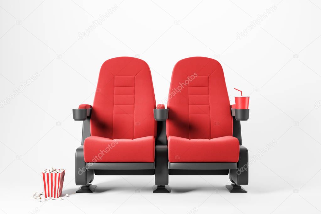 Two red cinema chairs on white background