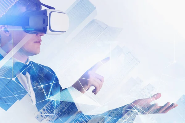 Man in VR glasses working with digital network — Stock Photo, Image