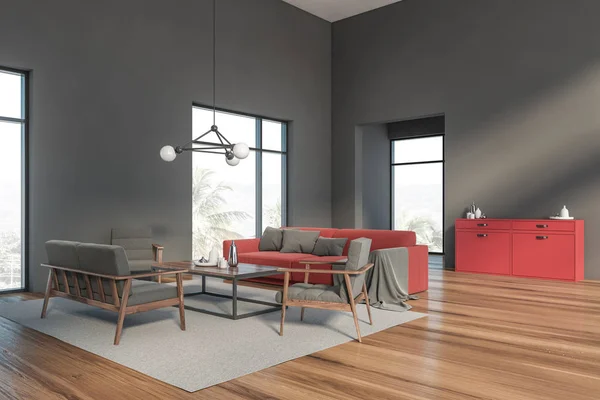 Graue Wohnzimmerecke mit rotem Sofa — Stockfoto