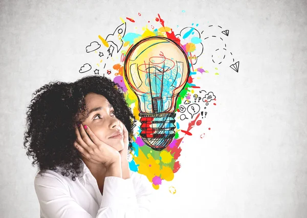 Thoughtful young woman and her bright idea — Stock Photo, Image