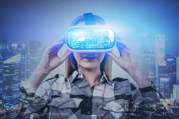 Young woman in VR glasses in virtual city