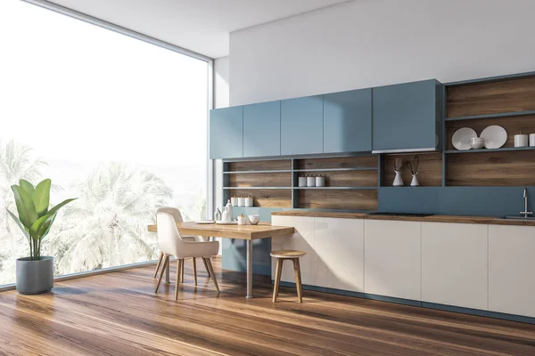 Panoramic blue kitchen corner with table