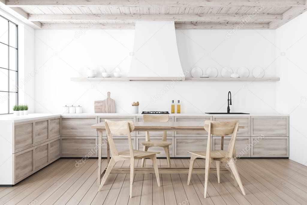 White kitchen interior with wooden table