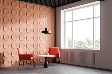 Pencereli turuncu ofis bekleme odası köşesi