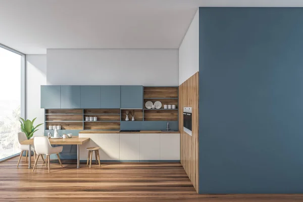 Blue and wooden kitchen with mock up wall