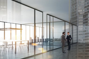 Ofis lobisinde el sıkışan erkekler