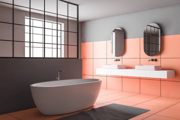 Orange and gray bathroom corner, tub and sink
