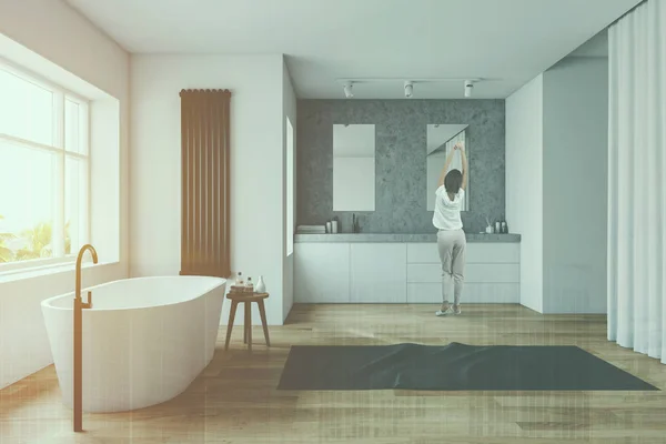 Woman in white and stone bathroom — Stock Photo, Image