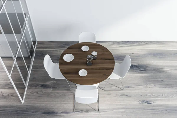 Top view of white dining room with round table