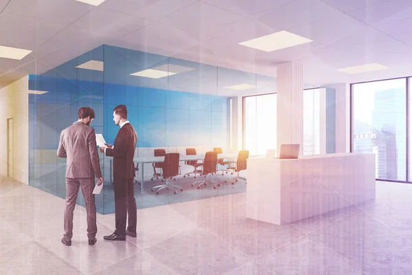 People in blue office with reception — Stock Photo, Image