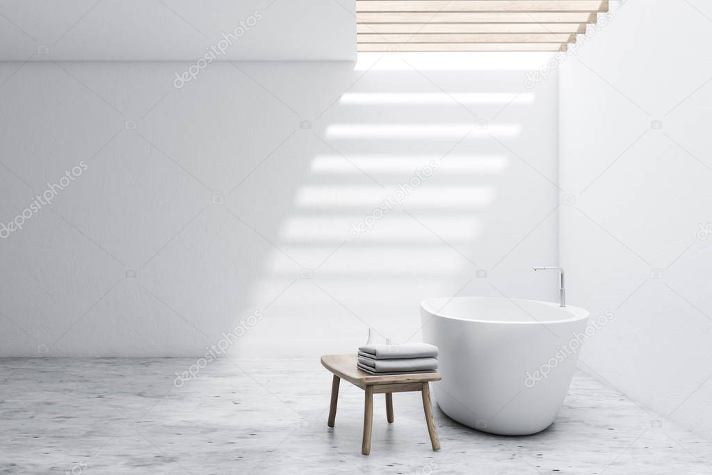 Spacious white bathroom with tub