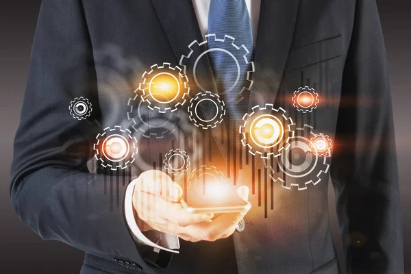 Akıllı telefon, dişliler ve grafik ile İşadamı