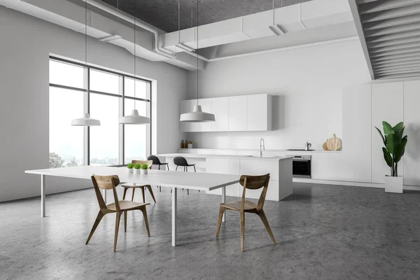 Masa ile beyaz mutfak köşesi