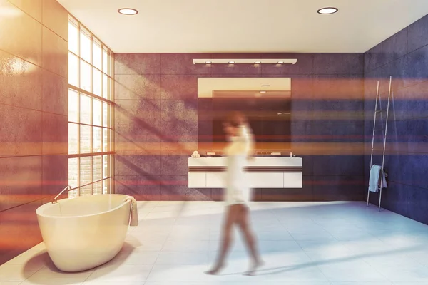 Woman walking in blue stone bathroom — Stock Photo, Image