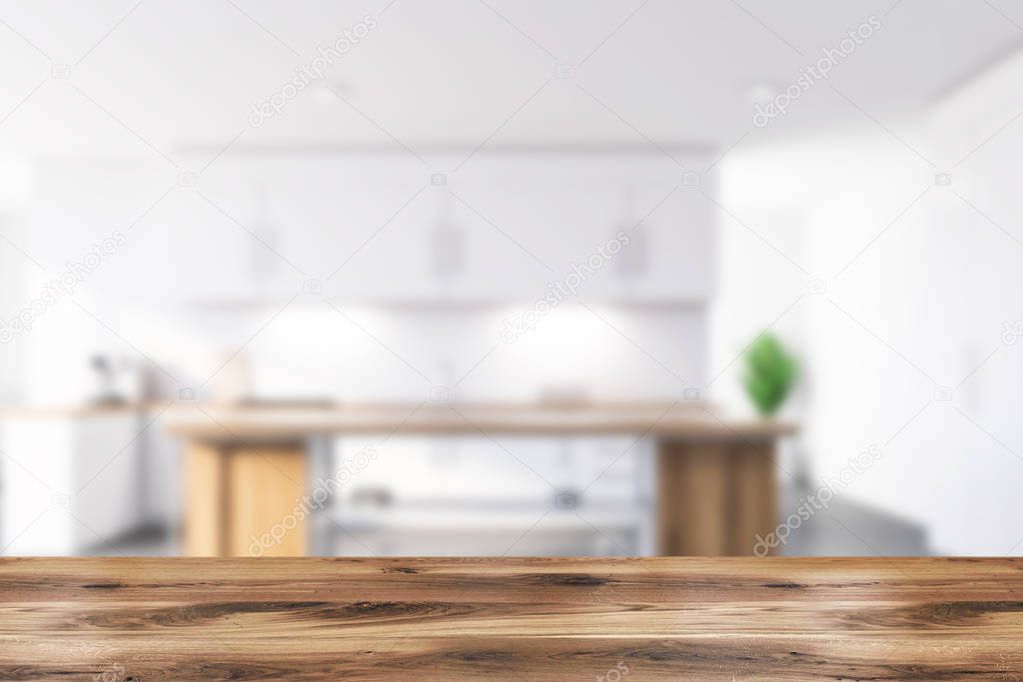 Blurred white kitchen interior with island