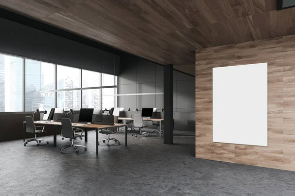 Темно-сірий і дерев'яний офіс простору з плакатом — стокове фото