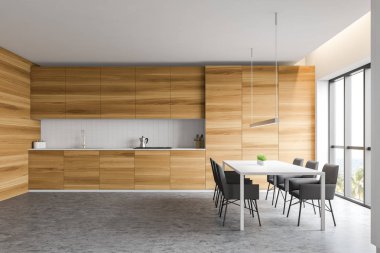 Masa ile beyaz ve ahşap mutfak