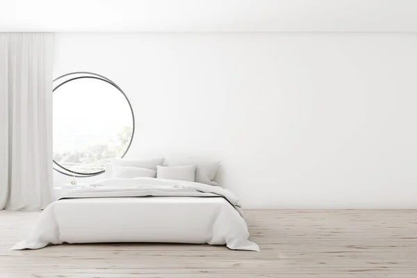 White bedroom interior with round window