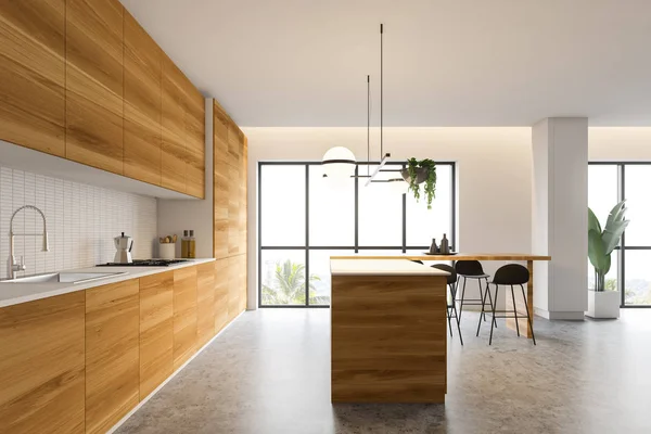 Boční pohled na bílou a dřevěnou kuchyň s barem — Stock fotografie