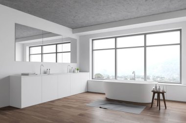 Lavabosu ve küveti olan ferah beyaz banyo köşesi.