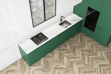 Yeşil tezgahlı beyaz mutfak, üst manzara.