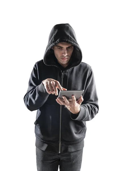 Hacker in hoodie using tablet, isolated — Stock Photo, Image