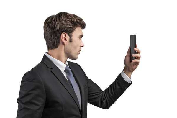 Handsome businessman looking at phone, isolated — Stock Photo, Image