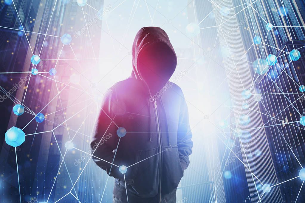 Hacker in hoodie and network interface