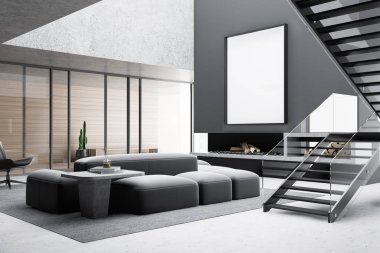 Gri oturma odası köşesi, şömine ve poster.