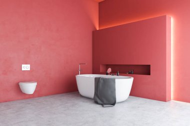 Küveti ve tuvaleti olan kırmızı banyo köşesi.